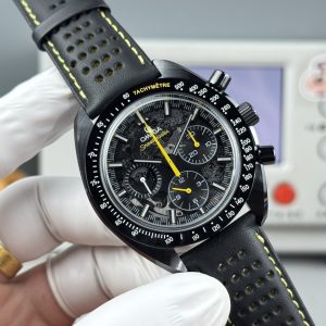 Alternative view of The first-generation "All-Ceramic" Apollo BLS collection debuts Omega's latest Speedmaster Dark Side of the Moon watch, featuring an all-ceramic construction. Ceramic is an inorganic non-metallic substance formed through high-temperature firing. This material enables the creation of high-density watch components with exceptional mechanical properties.Ceramic ranks among consumers' most favored materials for watches, owing to its striking and diverse colors alongside exceptional properties. Twice as light as stainless steel, ceramic offers superior wear resistance, high scratch resistance, biocompatibility, hypoallergenicity, and non-magnetic properties.This timepiece features a 44.25mm case housing a blackened movement. Laser ablation technology recreates the authentic lunar surface on the movement's bridges, paying homage to the Speedmaster's pivotal role in the Apollo 8 mission.Through the skeletonized dial crafted from black anodized aluminum, the near side of the moon—visible from Earth—is clearly visible. The caseback reveals the far side of the moon, seen only by astronauts. The watch is paired with a black micro-perforated rubber strap featuring a striking yellow rubber insert.The entire watch is crafted from black ceramic, featuring a central chronograph seconds hand adorned with yellow lacquer and a bezel with laser-engraved bright white enamel tachymeter scale.The small seconds hand is crafted from Grade 5 titanium, ingeniously shaped to resemble the Saturn V rocket. This 3D form is achieved through laser milling, with color variations created by applying white lacquer, laser ablation, and laser blackening techniques.